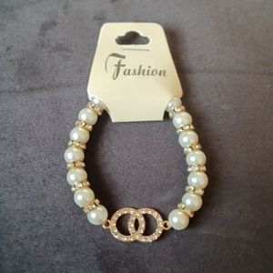 Inspired pearl and gold bracelet with silver righnstones!💚💜